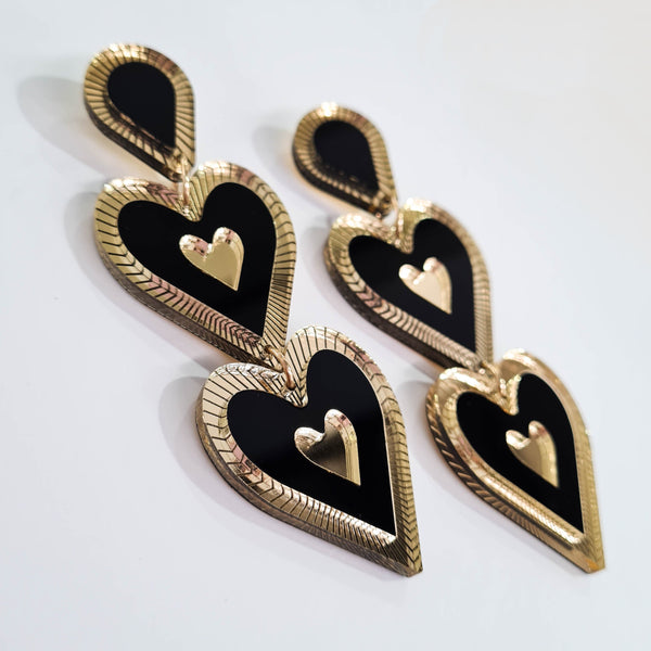 Heart shaped double drop Statement earring, Etched details in Gold Mirror. Black, Gold mirror, in colour, medium to large in size light weight on your ears. 