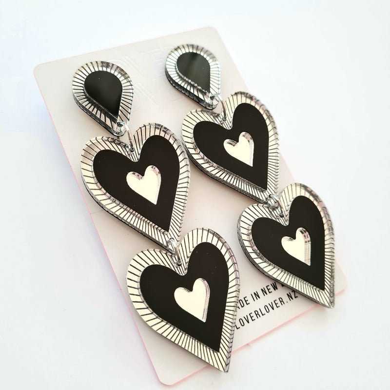 Heart shaped double drop Statement earring, Etched details in silver Mirror. Black, silver mirror, in colour, medium to large in size light weight on your ears. 