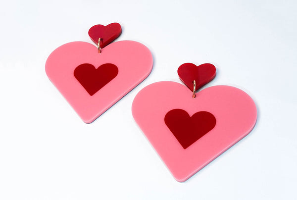 Heart shaped statement earring. Pink and red in colour. Medium in size but still light on your ear. 