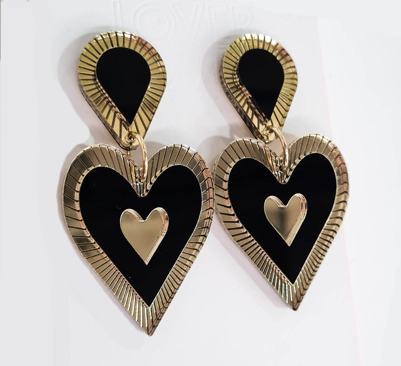 Heart shaped drop statement earring with tear drop top. Gold Etched mirror details. Black and gold in colour. 