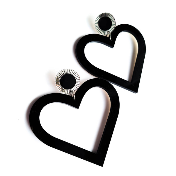 Bold Heart shaped Statement earring with etched silver mirror detail. Black and Silver in colour. Large in size but light and comfortable on your ear. 